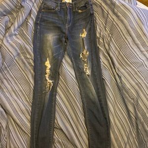 These are High Rise jeans. They are from the brand Mudd.